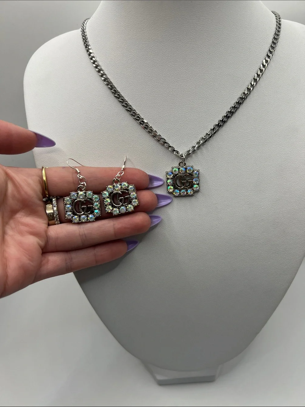 1469. Silver Tone Necklace & Earrings Set 18” with AB crystal stamped charms